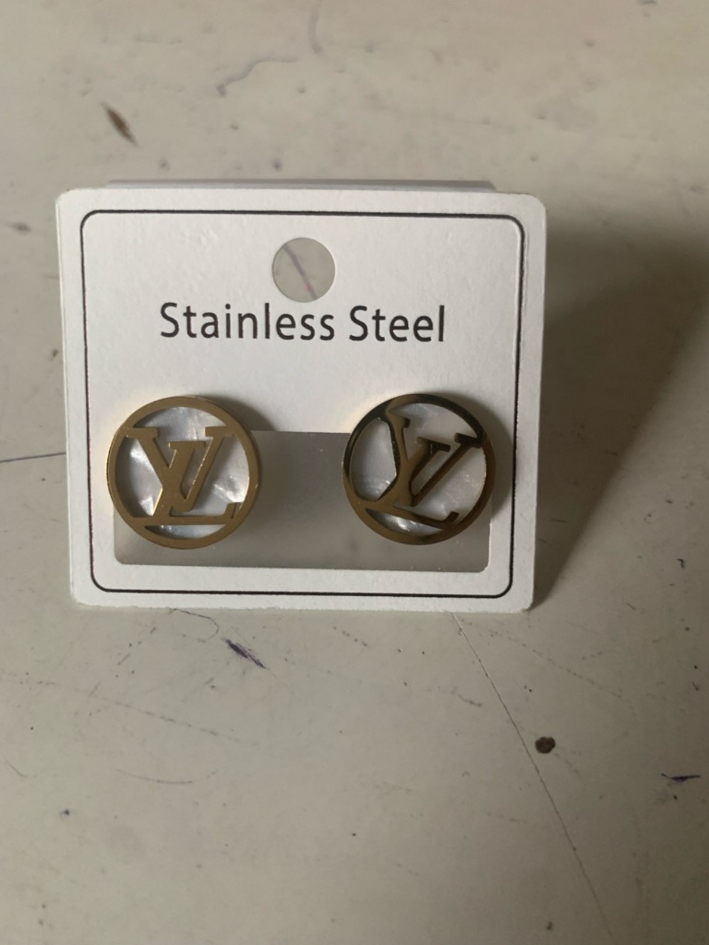 Gold-Tone Round Logo Cutout Stainless Steel Stud Earrings